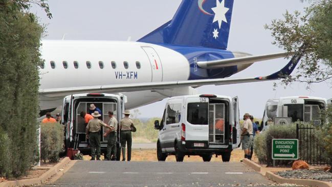 October 27: Female prisoners prepare to board a chartered flight to Darwin at Alice Springs Airport, where they will be rehoused to Darwin Correctional Centre. Picture: Gera Kazakov