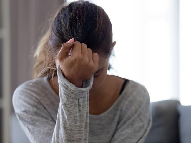 Depressed upset young woman feeling hurt sad stressed troubled with unwanted pregnancy, regret mistake abortion, having headache or drug addiction, suffer from grief dramatic bad problem concept