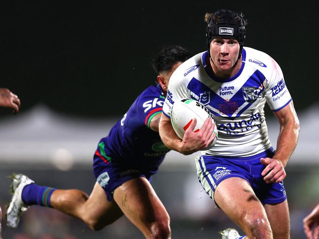 AUCKLAND, NEW ZEALAND - AUGUST 23: Matt Burton of the Bulldogs is tackled during the round 25 NRL match between New Zealand Warriors and Brisbane Broncos at Shaun Johnson Stadium, on August 23, 2024, in Auckland, New Zealand. (Photo by Phil Walter/Getty Images)