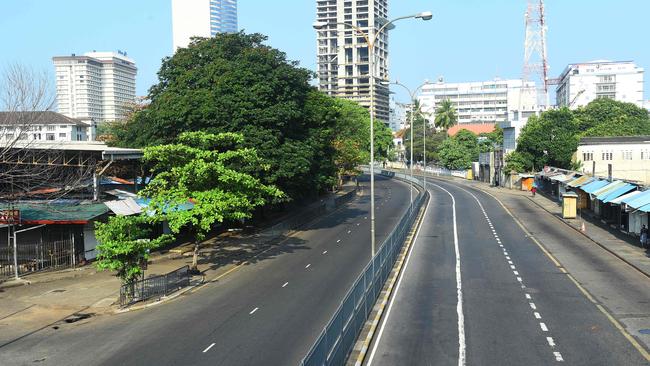 An empty street in Colombo on Saturday after authorities announced a weekend curfew in the country as a preventive measure against the spread of the COVID-19. Picture: AAP