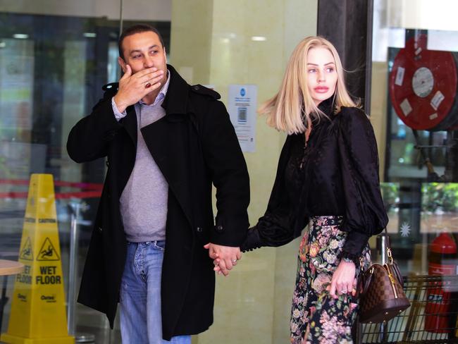 Marwan Haddad and Catherine Le Brocq say goodbye to supporters before entering the Downing Centre court complex. Picture: NCA NewsWire / Gaye Gerard