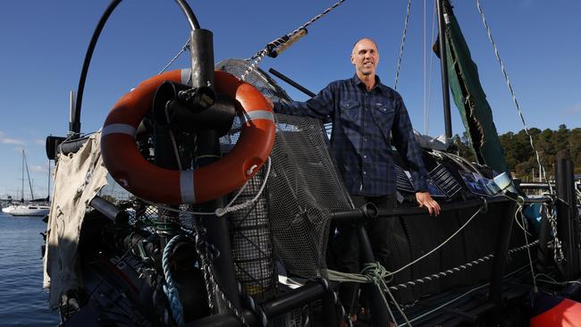 Samuel McLennan with the raft at Oyster Cove Marina after travelling down the Derwent River from Hobart. Picture: Nikki Davis-Jones