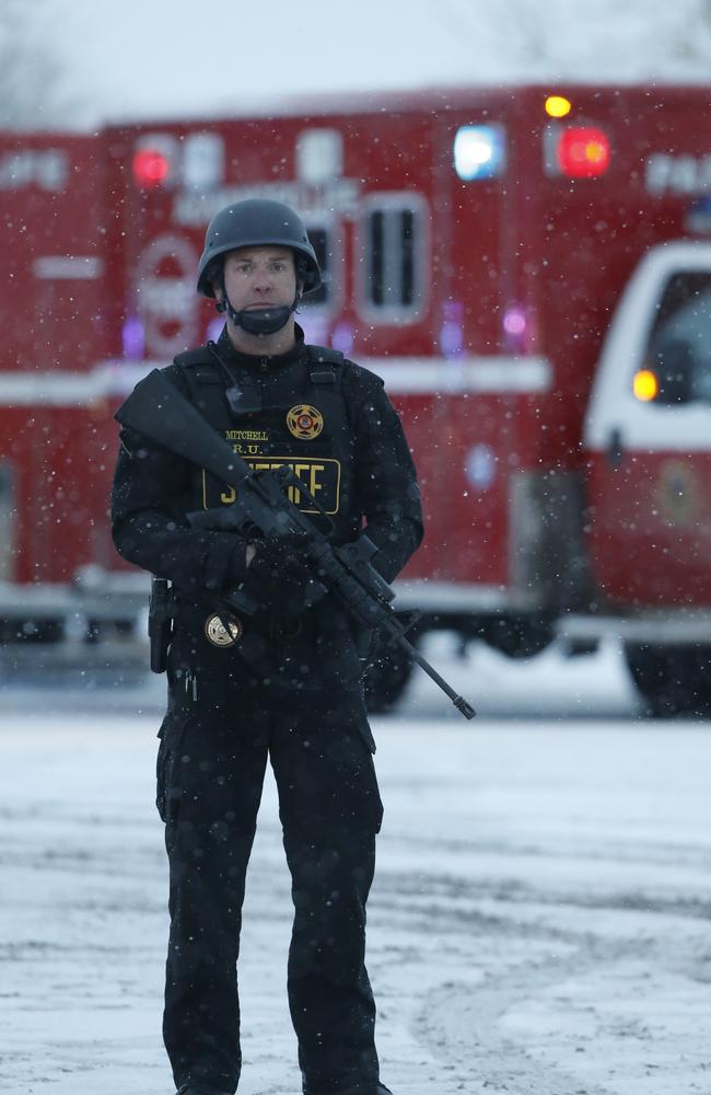 Standoff ... An officer stands guard near the Planned Parenthood clinic.