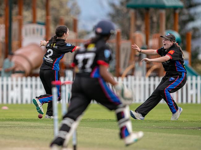 Ella Yates and Nicola Hudson celebrate following the final Manly wicket. Picture: Julian Andrews