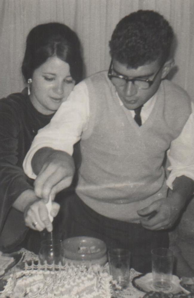 Mary helps Johnny cut the cake at their 21st birthday, around the time he was sent to a mental institution.