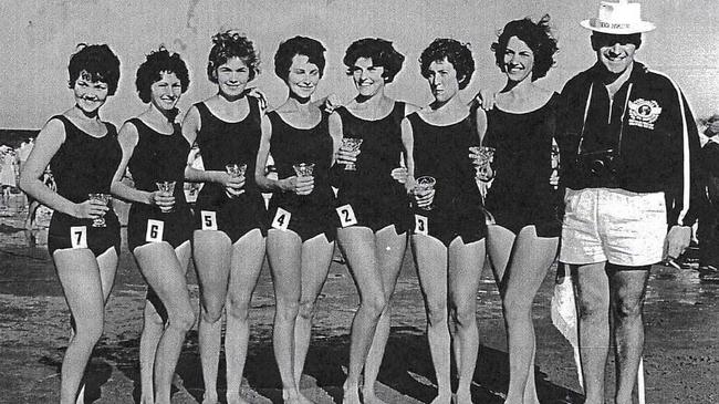 Ben Lathouras coaching the Siren of the Surf team – Patty Dean, Noela Freeman, Carolyn Pye, Josie Purkis, Kay Doneman, Leone Pukallas and Yvonne Brown.