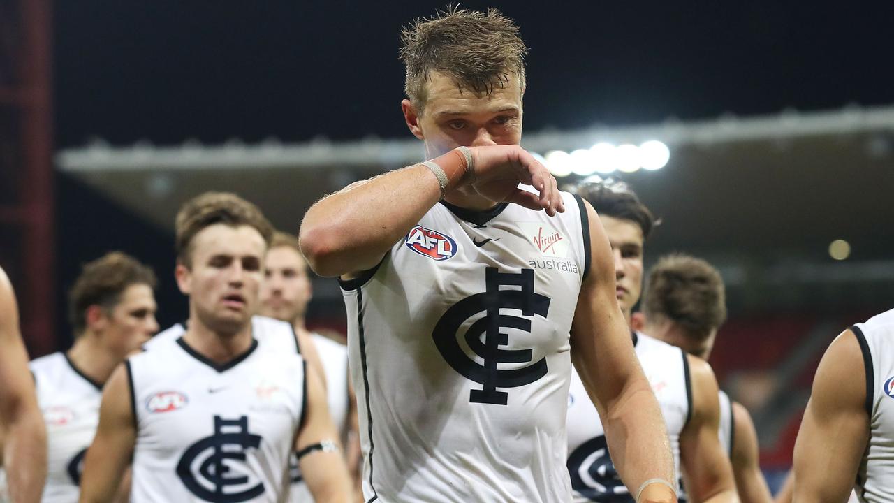 A dejected Patrick Cripps leads his Blues players off the field after another loss.