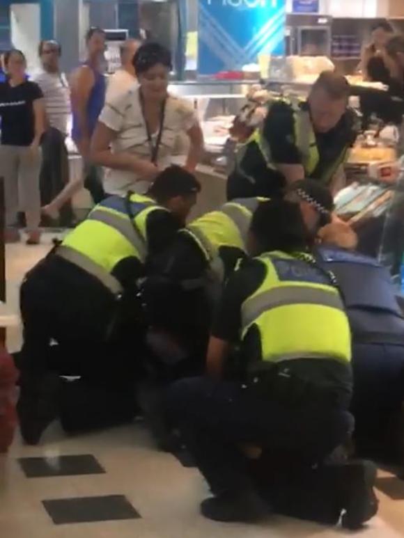 Footages shows police apprehending the person at Knox Shopping Centre. Picture: Urban Desi, Facebook.