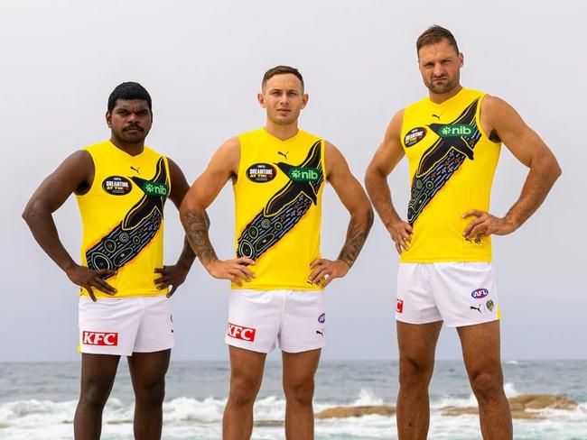Maurice Rioli Jr, Rhyan Mansell and Toby Nankervis model Richmond’s Indigenous jumper.