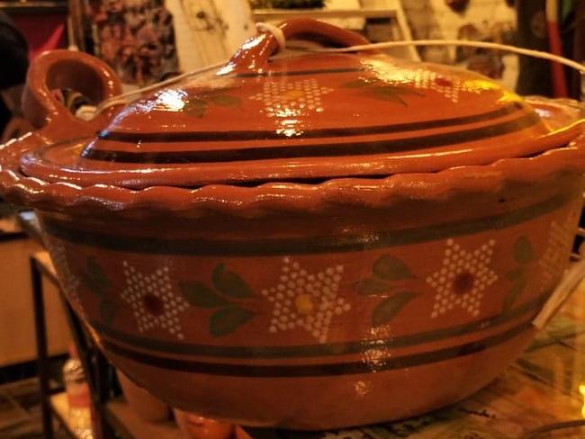 A handmade clay pot used for guisados is one of the many items of serving-ware and crockery commissioned from local makers in Mexico.