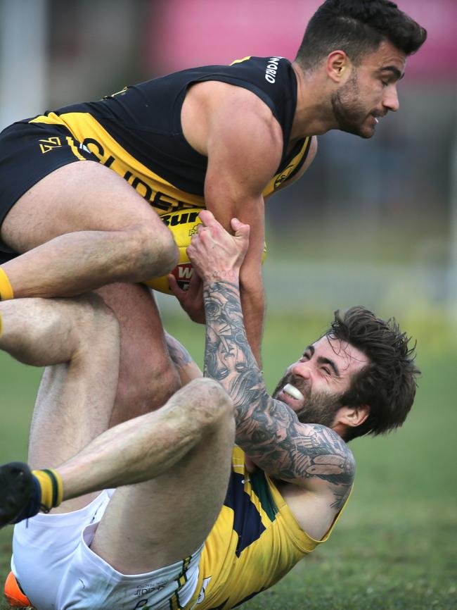 Not very often were the Tigers on top of the Eagles. Nicholas Amato tangles with Eagle Jack Firns. Picture: Dean Martin/AAP