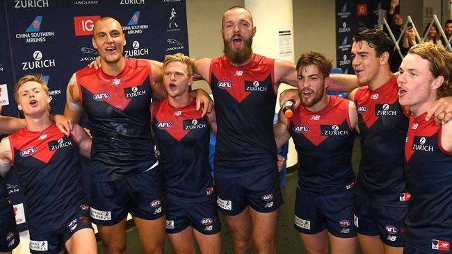 Max Gawn leads the rendition of “The Grand old flag”. Picture: AAP