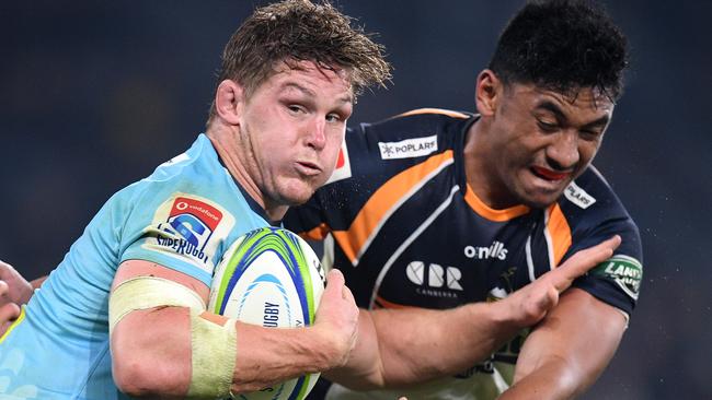 Michael Hooper of the Waratahs fends off a tackle by Irae Simone of the Brumbies during the Round 17 Super Rugby match between the NSW Waratahs and the ACT Brumbies at Bankwest Stadium in Sydney, Saturday, June 8, 2019. (AAP Image/Dan Himbrechts) NO ARCHIVING, EDITORIAL USE ONLY