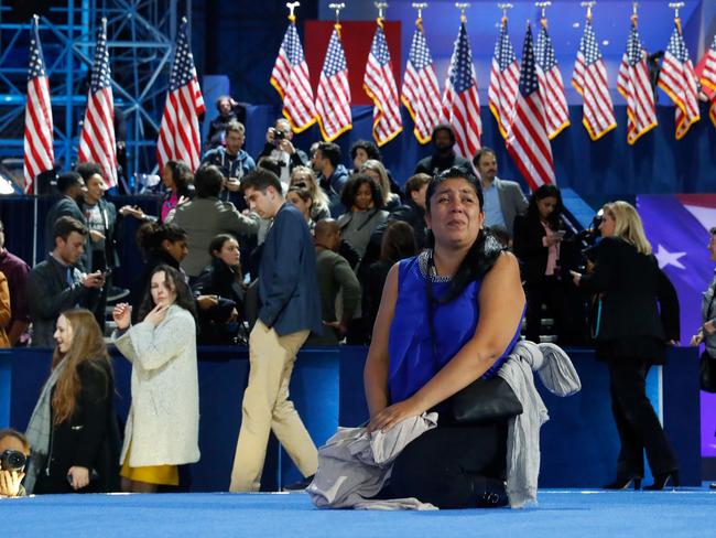 NEW YORK, NY - NOVEMBER 09: A woman watches as Campaign chairman John Podesta speaks on stage at Democratic presidential nominee former Secretary of State Hillary Clinton's election night event at the Jacob K. Javits Convention Center November 9, 2016 in New York City. Clinton is running against Republican nominee, Donald J. Trump to be the 45th President of the United States. Aaron P. Bernstein/Getty Images/AFP == FOR NEWSPAPERS, INTERNET, TELCOS & TELEVISION USE ONLY ==