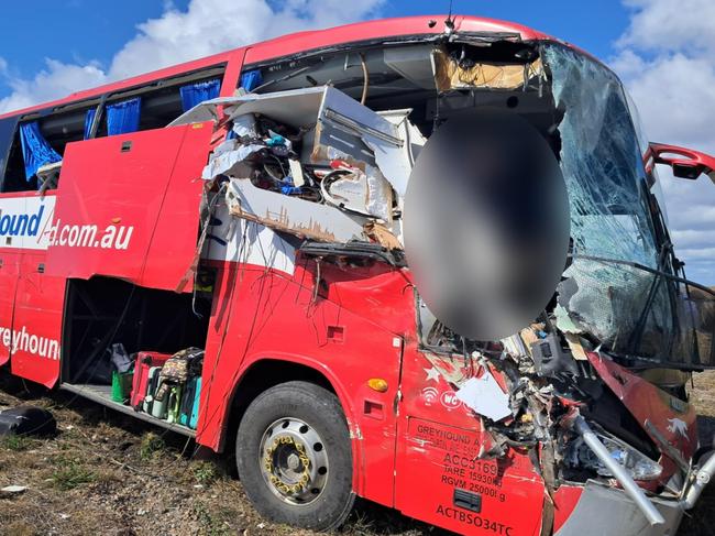 Photographs taken in the immediate aftermath of a horror fatal Greyhound passenger bus crash at Gumlu on the Bruce Highway south of Ayr on Sunday. The bus driver, picture, miraculously survived. The bus carrying 33 passengers was travelling north when it collided head on with a caravan being towed by a four-wheel drive driven by an elderly couple. Three passengers on the bus were killed while two others remained in critical conditions in Townsville University Hospital on Monday morning. Picture: Supplied