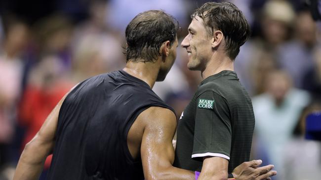 Nadal hugs Millman after beating the Australian. Picture: AP