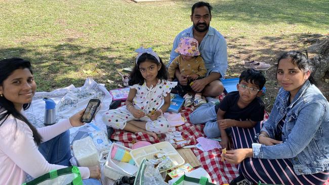 The Kare and Mullangi families of Westmead and Glenwood enjoy a picnic.