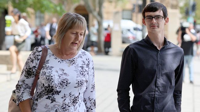 Matthew Odgers and his mother Maria Odgers outside Adelaide Magistrates Court. Picture: Kelly Barnes