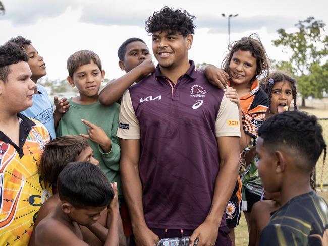 Selwyn Cobbo with kids from the Cherbourg Rugby League Club in 2023.