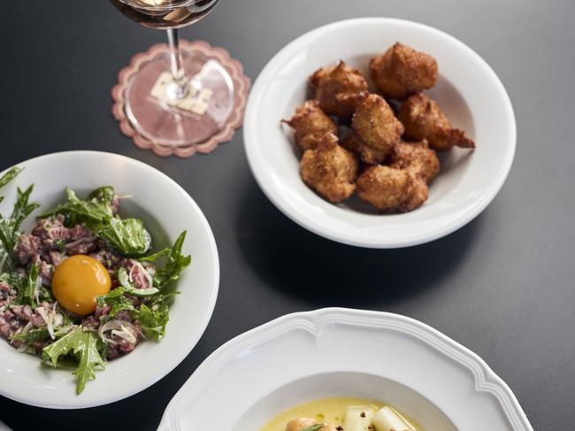 Food at Ogee in Hobart. Clockwise from left: beef tartare, pomme dauphine, white asparagus. For TasWeekend Indulge. Picture: Supplied.