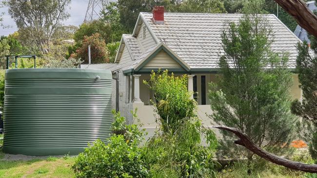 The rainwater tank put next to Branko Soda’s house at Magill. Picture: Colin James