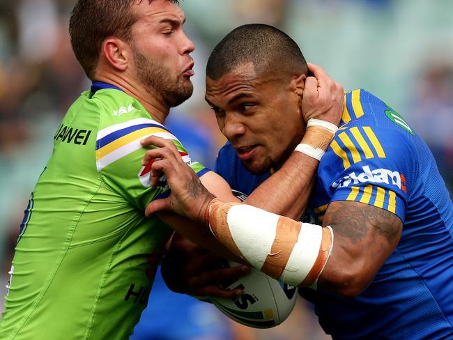 Parramatta's Manu Ma'u is wrapped up against the Canberra Raiders at Pirtek Stadium. Ma’u is up for grabs at $341,700. Picture: Gregg Porteous