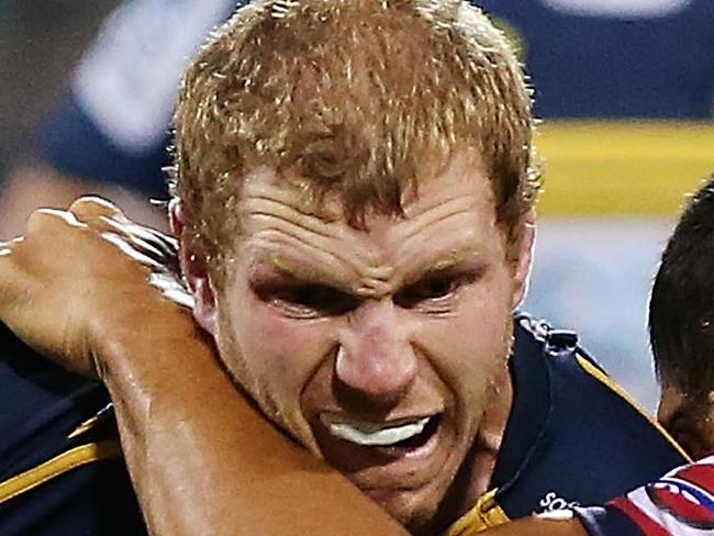 CANBERRA, AUSTRALIA - FEBRUARY 13: David Pocock of the Brumbies is tackled during the round one Super Rugby match between the Brumbies and the Reds at GIO Stadium on February 13, 2015 in Canberra, Australia. (Photo by Stefan Postles/Getty Images)