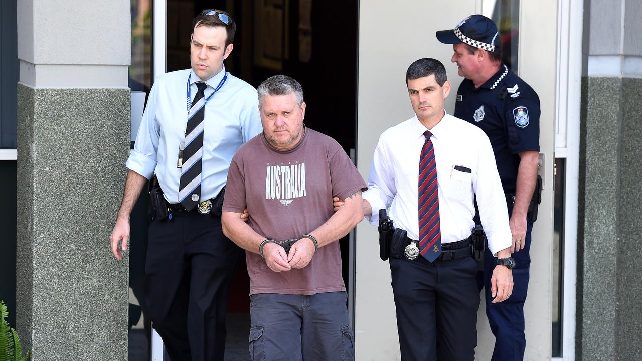 Rick Thorburn being escorted by police from the Logan Central Police Station, Queensland.