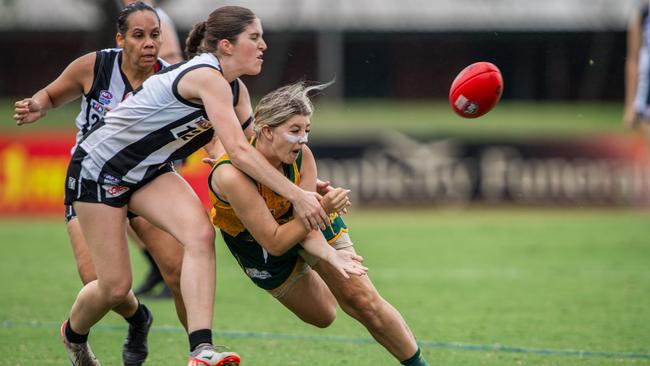 Georgia Marsland tackles Joanne Huddleston and Hannah Torsney as St Mary's take on the Palmerston Magpies women in Round 8 of the 2023-24 NTFL season. Picture: Pema Tamang Pakhrin