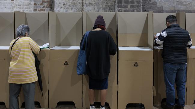 SYDNEY, AUSTRALIA - MAY 20: People cast their ballots during early voting for the seat of Wentworth at Oxford Street Mall on May 20, 2022 in Sydney, Australia. Independent Allegra Spender is standing for the seat of Wentworth against Liberal incumbent Dave Sharma. The Australian federal election will be held on Saturday 21 May 2022. (Photo by Brook Mitchell/Getty Images)