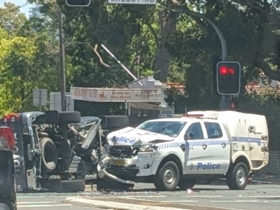 A car has flipped on its side after a major collision with a police car in Ryde. Picture: Supplied.