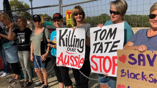 Protesters chained to the front gates of the work site at Black Swan Lake this morning. Picture: Paul Weston.