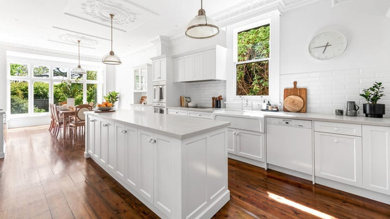 A kitchen featuring Miele appliances is part of the large open-plan living and dining space.