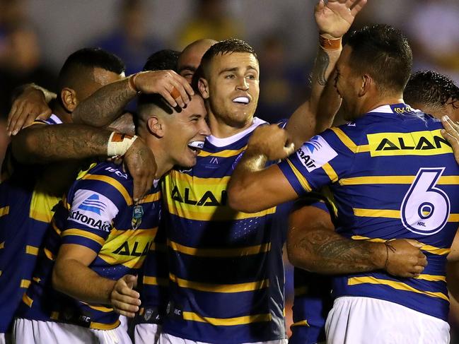 NEWCASTLE, AUSTRALIA - FEBRUARY 24:  Eels players celebrate a try during the NRL Trial Match between the Newcastle Knights and the Parramatta Eels at Maitland No 1 Showground on February 24, 2018 in Newcastle, Australia.  (Photo by Tony Feder/Getty Images)