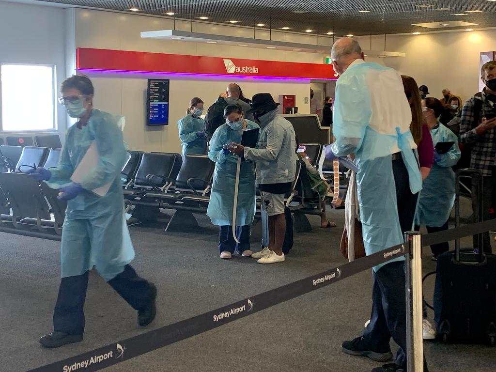 NSW Health workers screen people arriving at Sydney Airport on a flight from Perth. Picture: NCA NewsWire/Bianca De Marchi