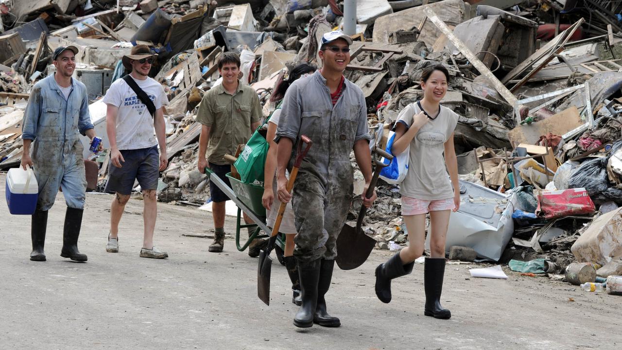 Mud Army volunteers after floods in Fairfield, Brisbane in January 2011. Picture: Mark Ralston/AFP