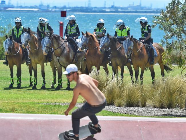 Police make their presence felt along the St Kilda foreshore. Picture: Tony Gough