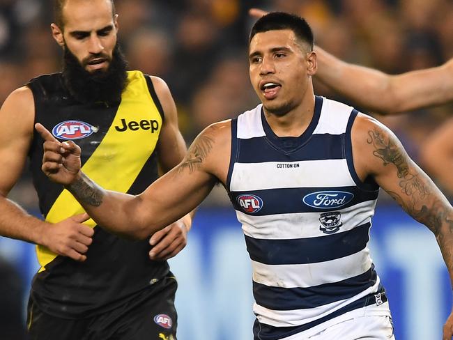 Tim Kelly of the Cats (centre) reacts after kicking a goal during the Round 12 AFL match between the Richmond Tigers and the Geelong Cats at MCG in Melbourne, Friday, June 7, 2019. (AAP Image/Julian Smith) NO ARCHIVING, EDITORIAL USE ONLY