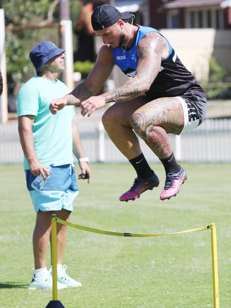 Sprint coach Roger Fabri, green top, trains Bronson Xerri in Maroubra a year before his return to the NRL. Picture: John Grainger.