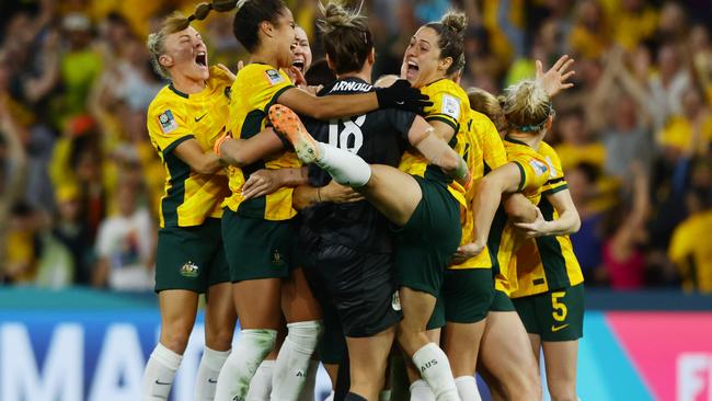 Matildas players celebrate winning the FIFA Womens World Cup Quarter final match between against France at Brisbane Stadium. Picture Lachie Millard