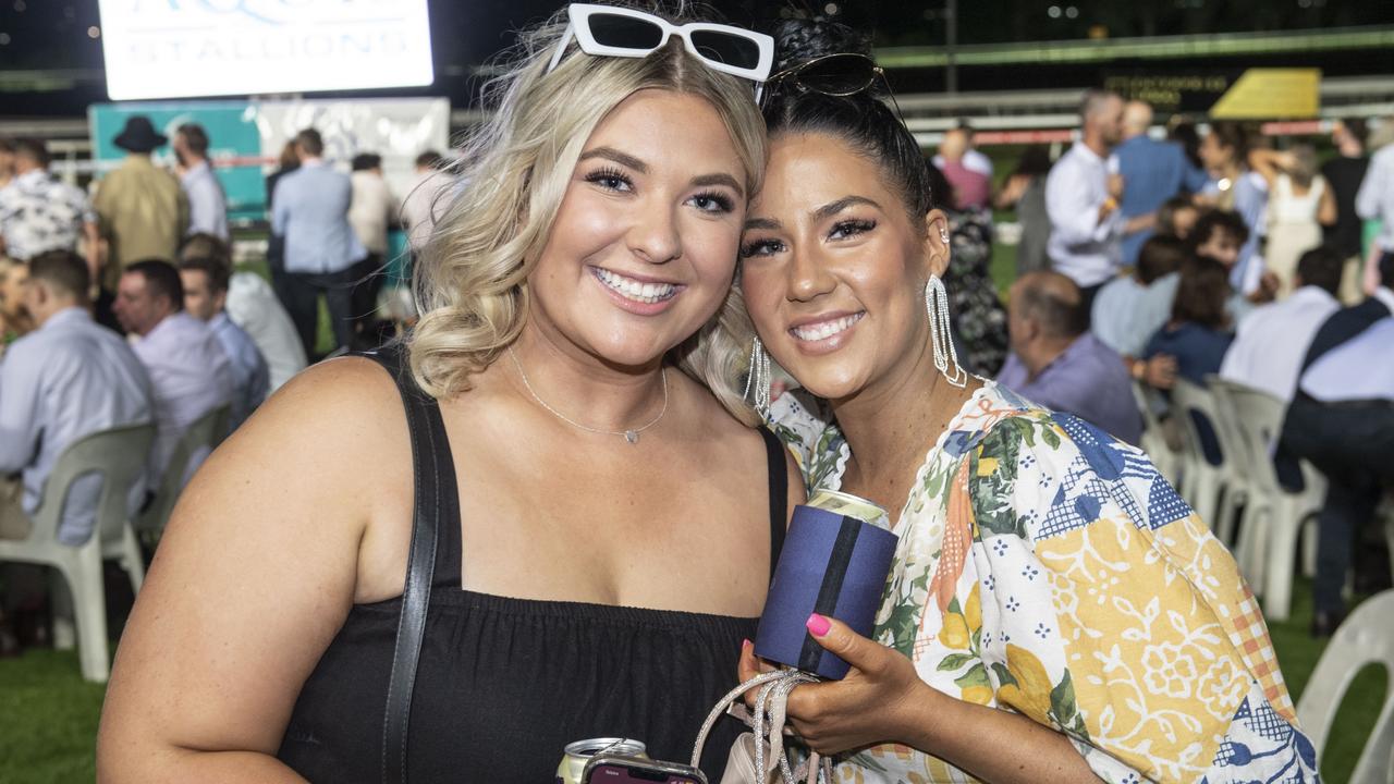 Ellie Kreicbergs-Prenzler and Alannah Caldwell. New Year's eve at King of the Mountain race day, Clifford Park race course. Saturday, December 31, 2022. Picture: Nev Madsen.