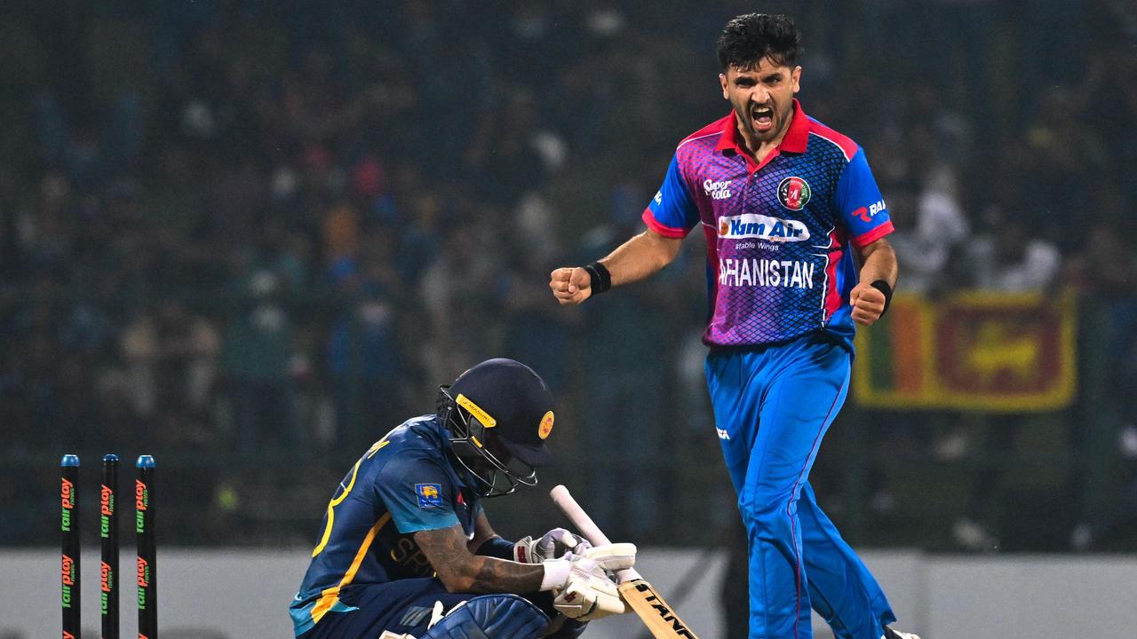 Fazalhaq Farooqi celebrates after taking a wicket. Picture: S. KODIKARA / AFP