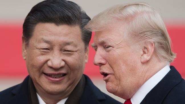 China's President Xi Jinping and US President Donald Trump attend a welcome ceremony at the Great Hall of the People in Beijing last November.