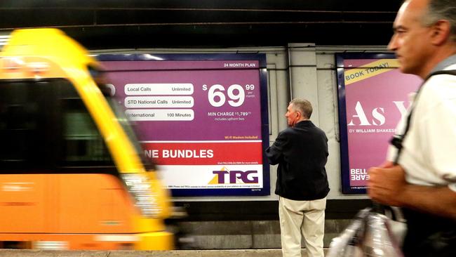 Business. TPG takeover of iiNet. A TPG Billboard at Wynyard Station.