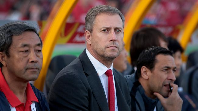 China's national coach Alain Perrin isn’t happy with the Suncorp surface.