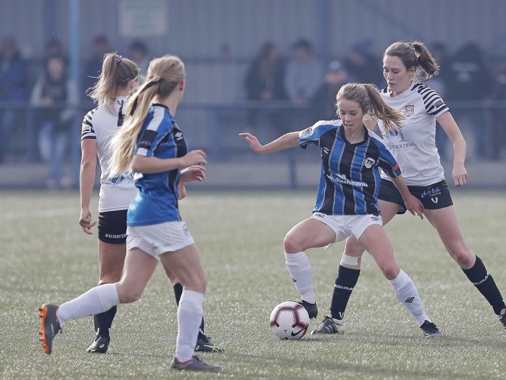 Hobart Zebras versus Kingborough Lions in the women's Statewide Cup final at KGV. Kingborough's Emille Tatton holds off her opponent, Hobart's Rachel Gill. Picture: PATRICK GEE