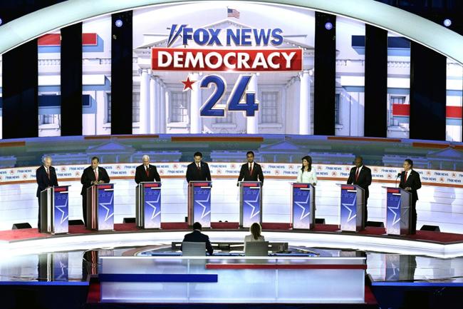 The candidates at their podiums for the first Republican primary debate of the 2024 cycle in the midwestern US city of Milwaukee