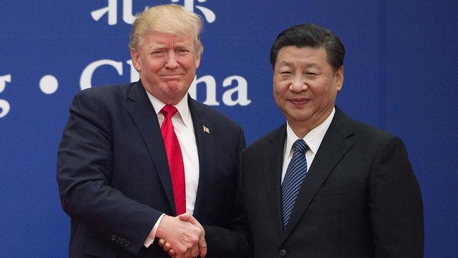 US President Donald Trump (L) and China's President Xi Jinping shaking hands during a business leaders event at the Great Hall of the People in Beijing in 2017.