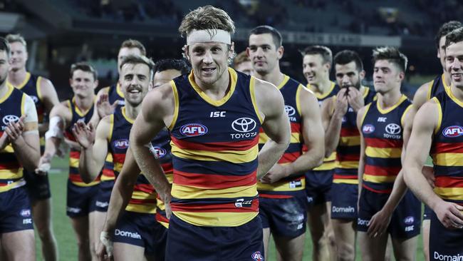 Adelaide’s Rory Sloane leads his team off after the win against Geelong on Thursday night. Picture SARAH REED