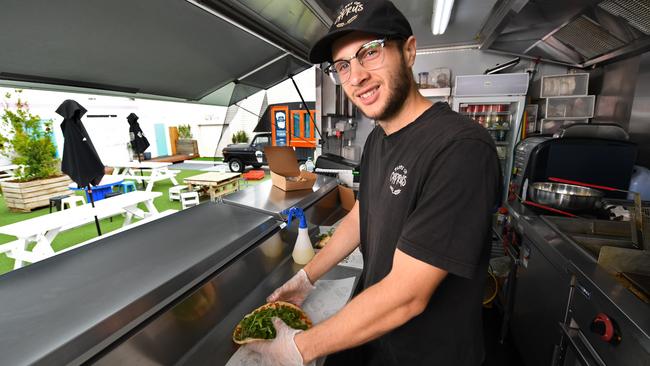 Number 9: Daniel Italiano prepares a souvlaki in his food truck Taste of Cyprus in Essendon. Picture: Julian Smith